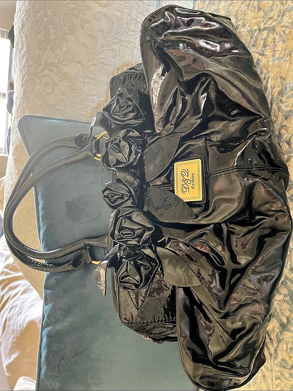 D&Z Black Patent Ruched Tote with floral detail.